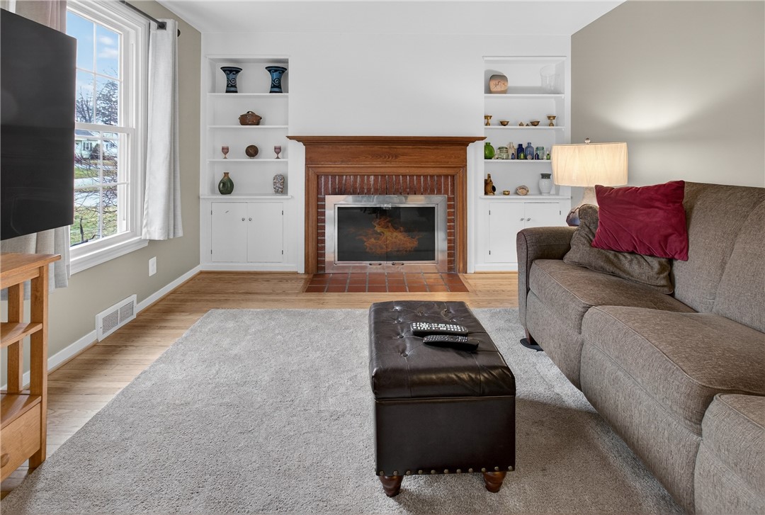 60 Hilltop Road Greece, NY 14616 - Photo 13 of 39 Cozy fireplaced living room!