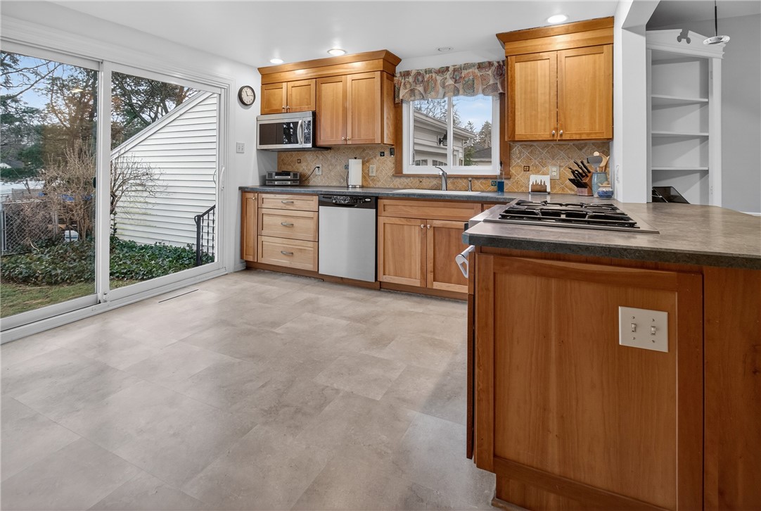60 Hilltop Road Greece, NY 14616 - Photo 6 of 39 Wide sliders open to a picturesque private view