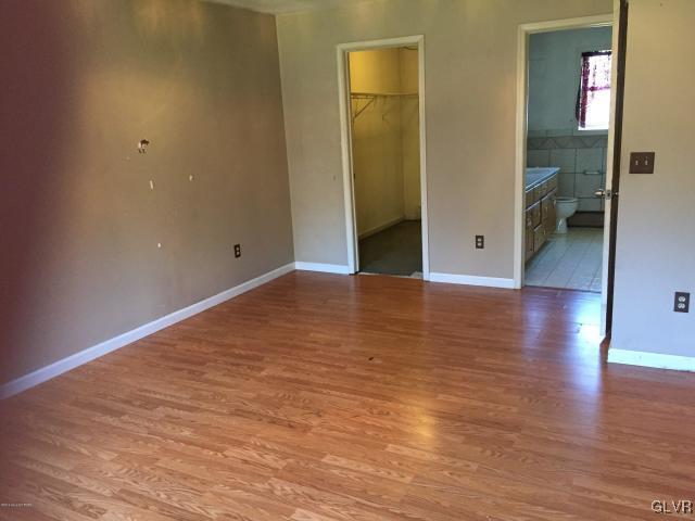 5644 Neola Road Stroudsburg, PA 18360 - Photo 14 of 24 a view of a room with wooden floor and an bathroom