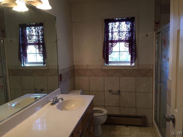 5644 Neola Road Stroudsburg, PA 18360 - Photo 17 of 24 a bathroom with a sink toilet and shower