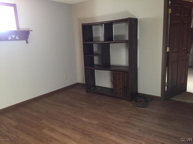5644 Neola Road Stroudsburg, PA 18360 - Photo 20 of 24 a view of an empty room with wooden floor