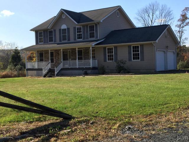 5644 Neola Road Stroudsburg, PA 18360 - Photo 2 of 24 a front view of a house with a yard