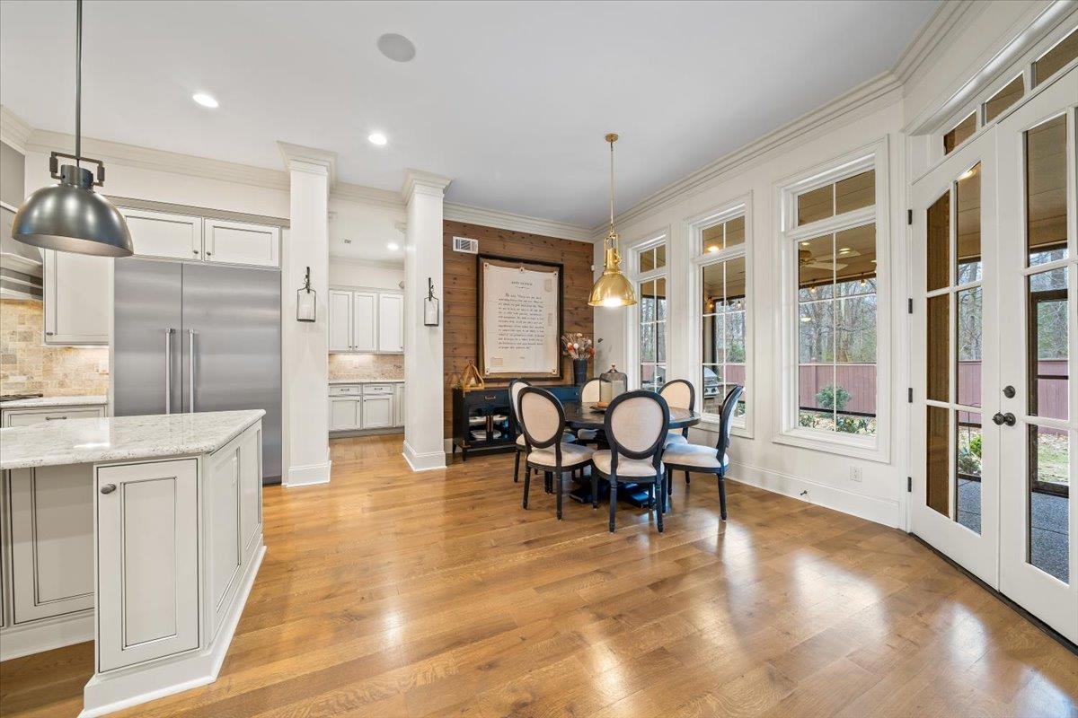 547 Lambs Brook Lane Collierville, TN 38017 - Photo 11 of 40 a view of a kitchen with dining room and wooden floor