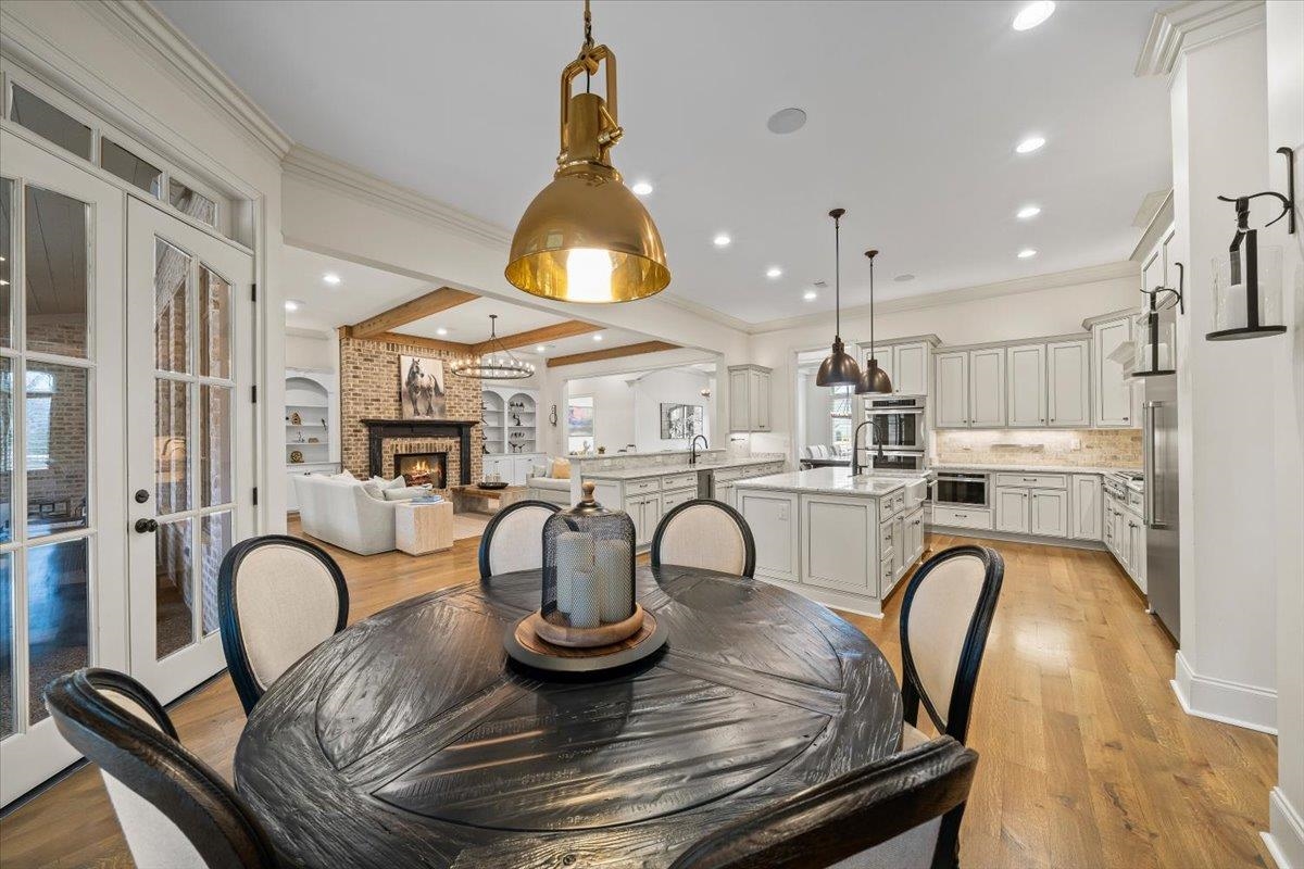 547 Lambs Brook Lane Collierville, TN 38017 - Photo 12 of 40 a kitchen with dining table and chairs