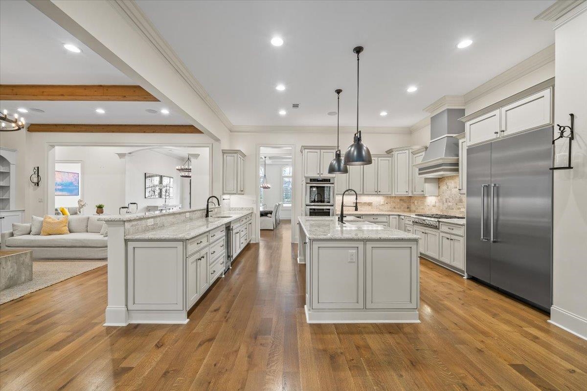 547 Lambs Brook Lane Collierville, TN 38017 - Photo 40 of 40 a large kitchen with kitchen island white cabinets and stainless steel appliances