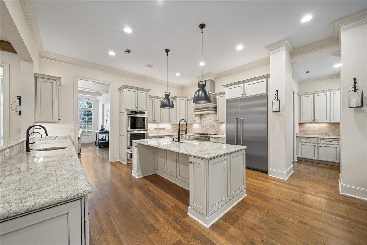 547 Lambs Brook Lane Collierville, TN 38017 - Photo 13 of 40 a kitchen with stainless steel appliances granite countertop a sink stove and refrigerator