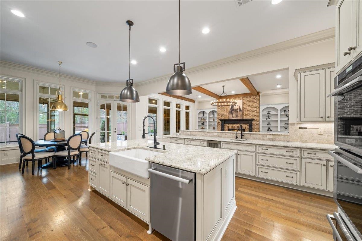 547 Lambs Brook Lane Collierville, TN 38017 - Photo 15 of 40 a large kitchen with kitchen island a sink and a stove top oven