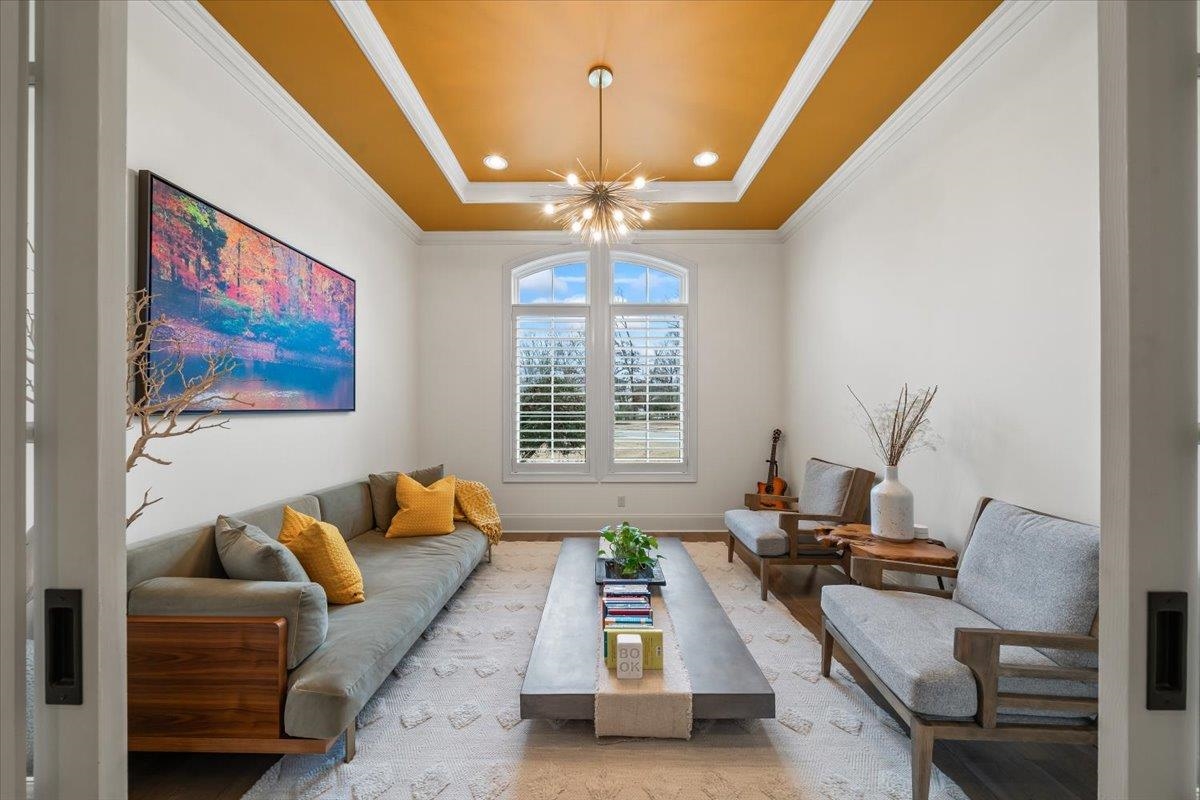 547 Lambs Brook Lane Collierville, TN 38017 - Photo 17 of 40 a living room with furniture and a chandelier