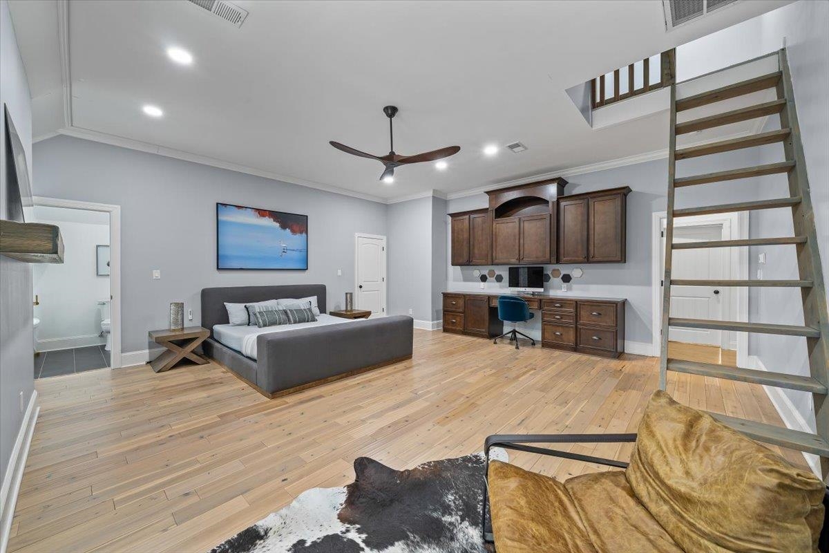 547 Lambs Brook Lane Collierville, TN 38017 - Photo 29 of 40 a living room with furniture wooden floor and a flat screen tv