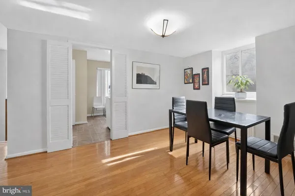 a view of a livingroom with furniture and wooden floor