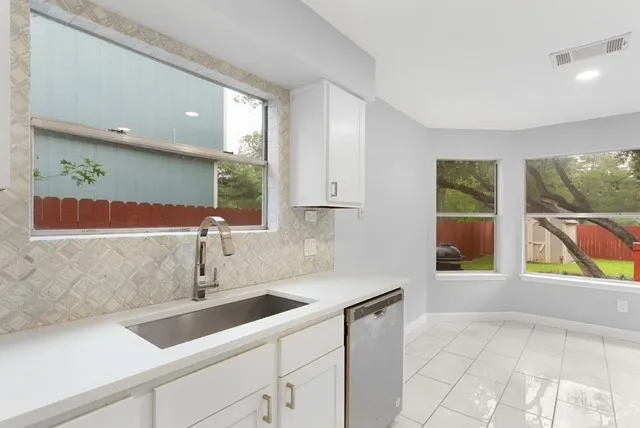 a bathroom with a toilet and a sink