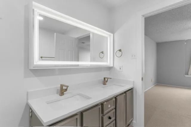 a bathroom with a glass shower door