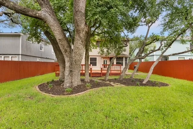 a front view of a house with a yard table and chairs