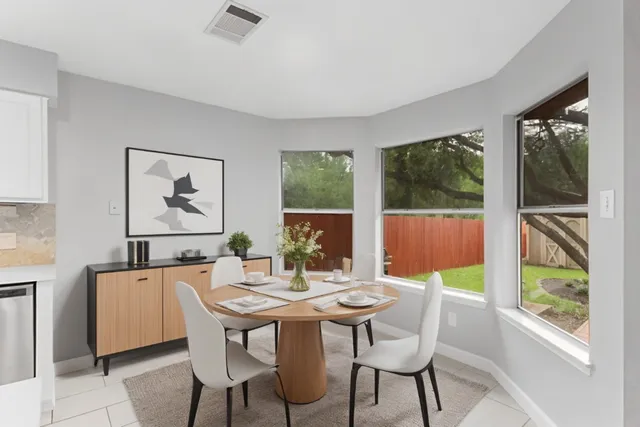 a view of a dining room with furniture window and outside view