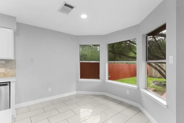 a kitchen with a sink appliances and cabinets