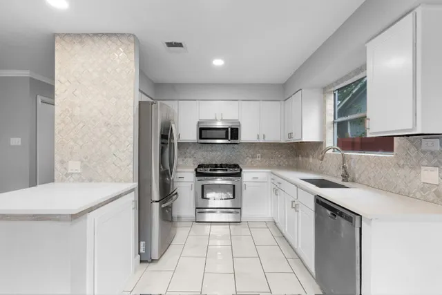 a kitchen with a sink and a window