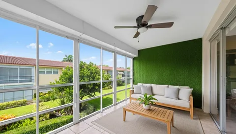 a balcony with furniture and a window