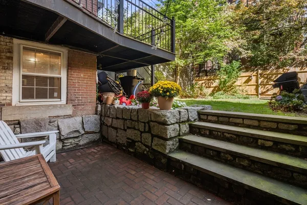 a view of a two chairs in the patio