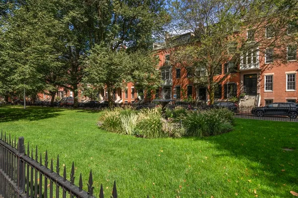 a view of a garden with houses