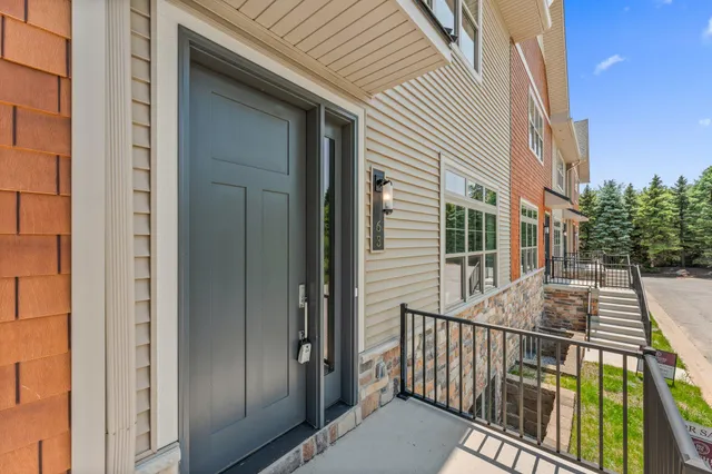an empty room with a window and a ceiling fan