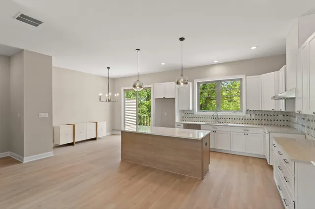 a view of balcony with wooden floor and potted plant