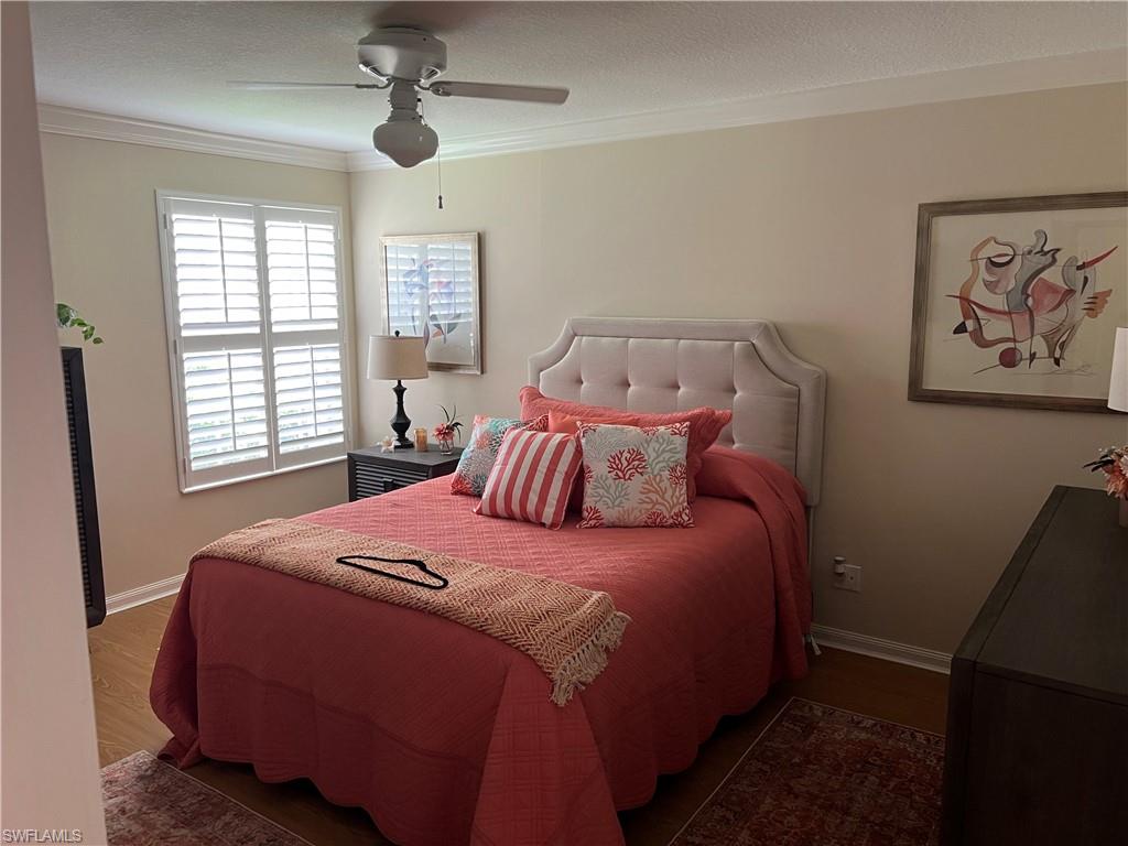 5433 Guadeloupe Way Naples, FL 34119 - Photo 13 of 16 a bedroom with a bed and a window