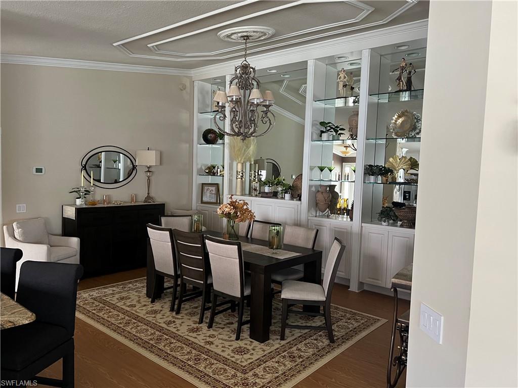 5433 Guadeloupe Way Naples, FL 34119 - Photo 7 of 16 a view of a dining room with furniture