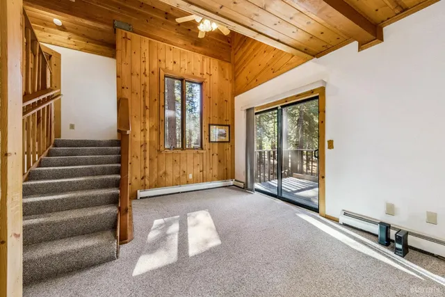 a view of an entryway with wooden floor and door