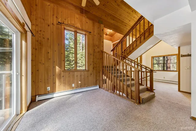 a view of a kitchen with a sink and a window