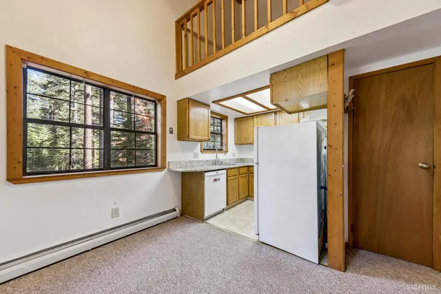 a view of a kitchen with furniture and a kitchen