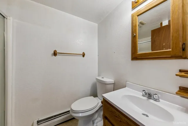 a view of staircase with railing and white walls