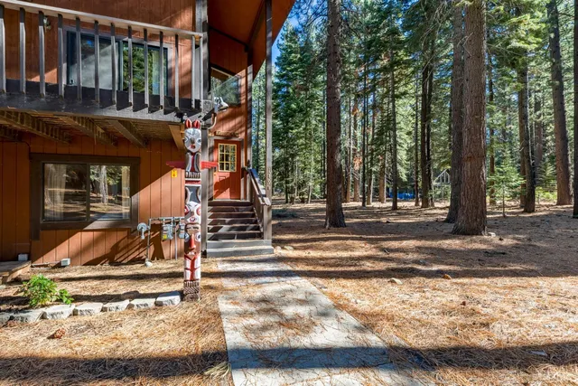 a view of trees from a balcony