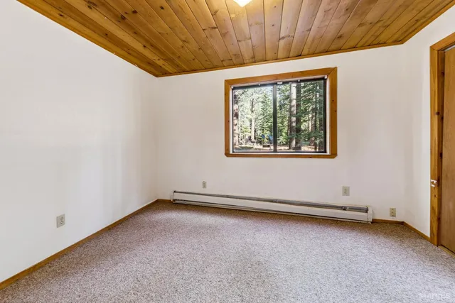a bathroom with a sink toilet and mirror
