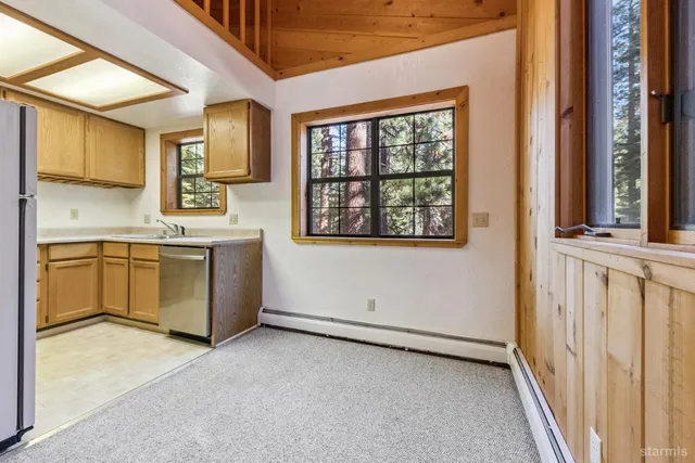 a view of a kitchen with a sink cabinets and a window