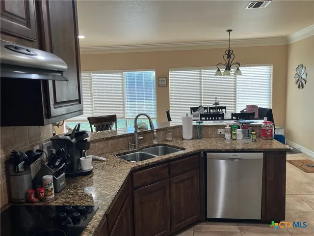 a kitchen with a sink and cabinets