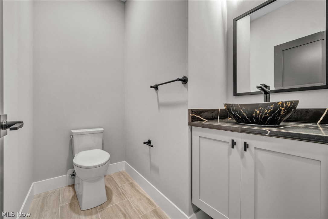 4009 Brainard Road Beachwood, OH 44122 - Photo 30 of 50 Bathroom with tile patterned floors, toilet, and vanity