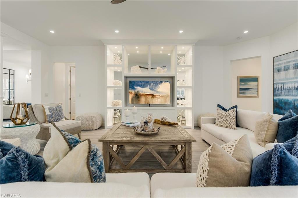 3664 Pilot Circle Naples, FL 34120 - Photo 12 of 35 a living room with furniture and wooden floor