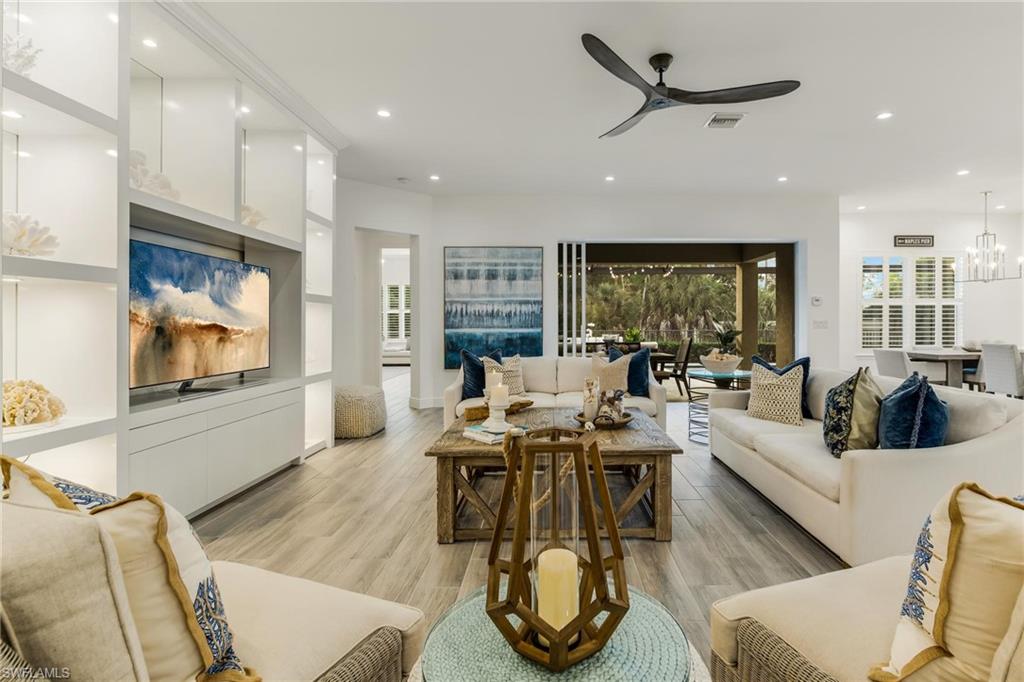 3664 Pilot Circle Naples, FL 34120 - Photo 20 of 35 a living room with furniture and a large window