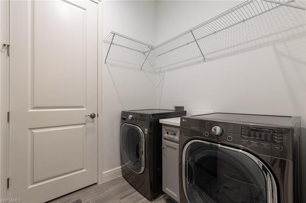 3664 Pilot Circle Naples, FL 34120 - Photo 23 of 35 a utility room with dryer and washer