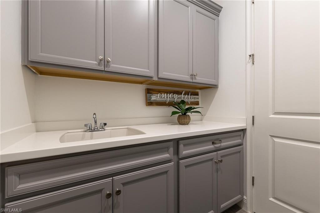 3664 Pilot Circle Naples, FL 34120 - Photo 24 of 35 a close view of sink and cabinets
