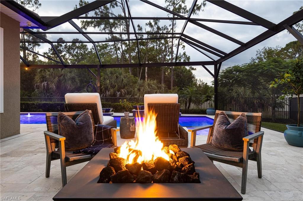 3664 Pilot Circle Naples, FL 34120 - Photo 30 of 35 a roof deck with table and chairs and barbeque