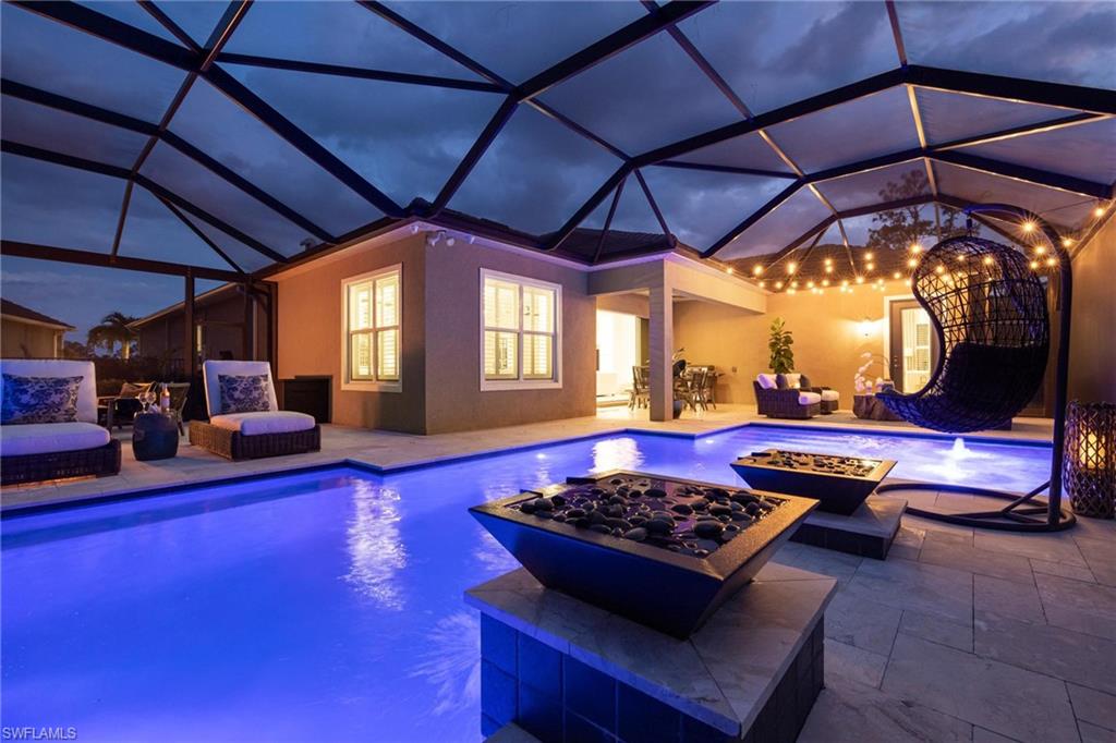 3664 Pilot Circle Naples, FL 34120 - Photo 33 of 35 a living room with furniture and a table