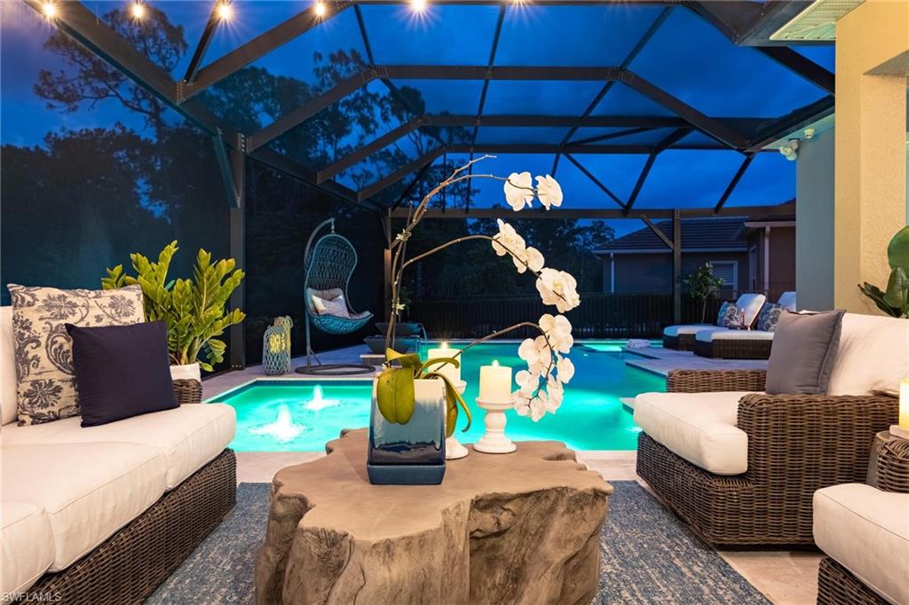3664 Pilot Circle Naples, FL 34120 - Photo 34 of 35 a outdoor living space with furniture and a fireplace