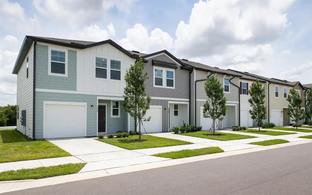 1068 Appleton Street Davenport, FL 33837 - Photo 1 of 1 a front view of a house with a yard and garage