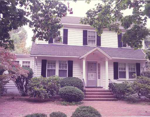 23 Chapin Road Newton, MA 02459 - Photo 1 of 1 a front view of a house with a garden