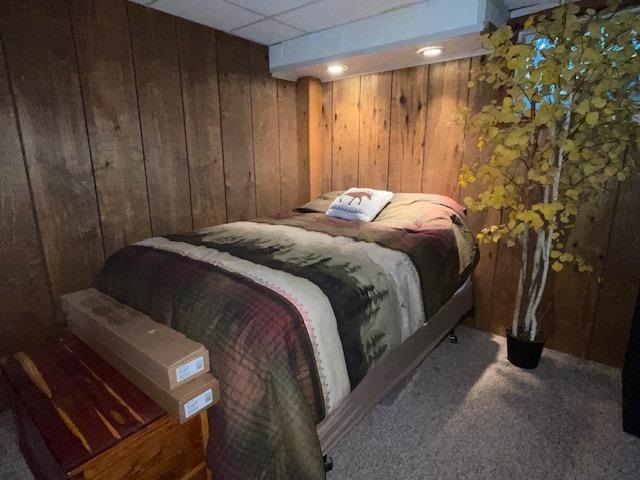3923 Scenic Bluff Road Thomson, IL 61285 - Photo 24 of 28 a bed sitting in a bedroom next to a shower curtain