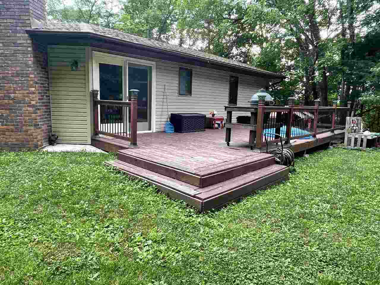 3923 Scenic Bluff Road Thomson, IL 61285 - Photo 3 of 28 a view of a backyard with wooden fence and a large tree