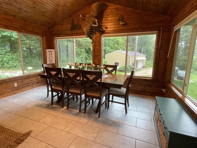 3923 Scenic Bluff Road Thomson, IL 61285 - Photo 8 of 28 a dining room with furniture and large windows
