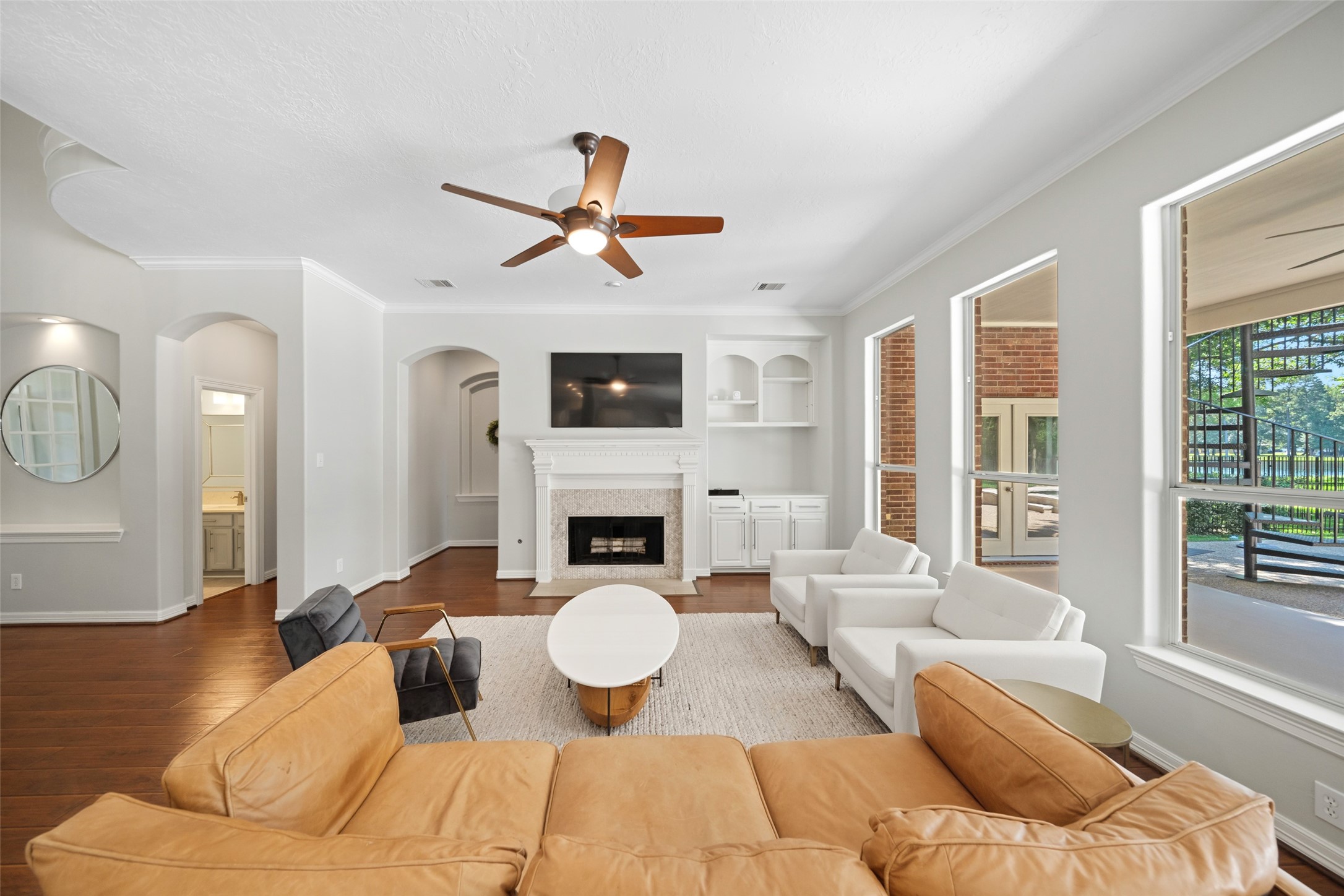 2302 Legends Shore Drive Spring, TX 77386 - Photo 13 of 48 Light-filled family room with expansive windows that bring the outdoors in.
