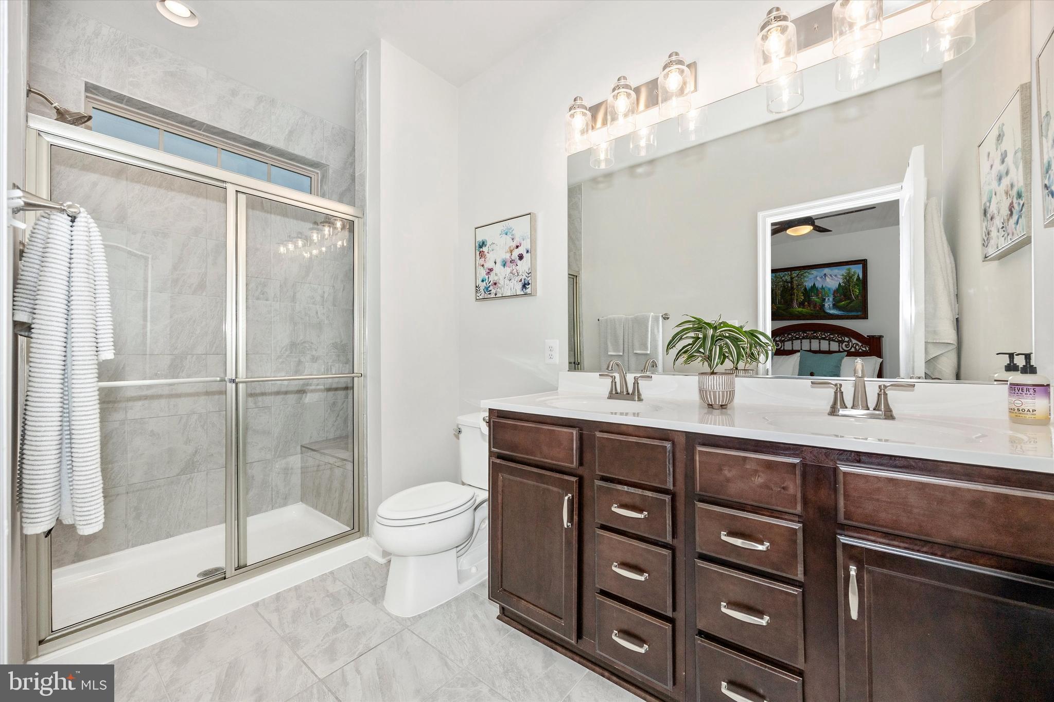 1817 Bird Run Frederick, MD 21702 - Photo 15 of 31 a spacious bathroom with a double vanity sink mirror and toilet